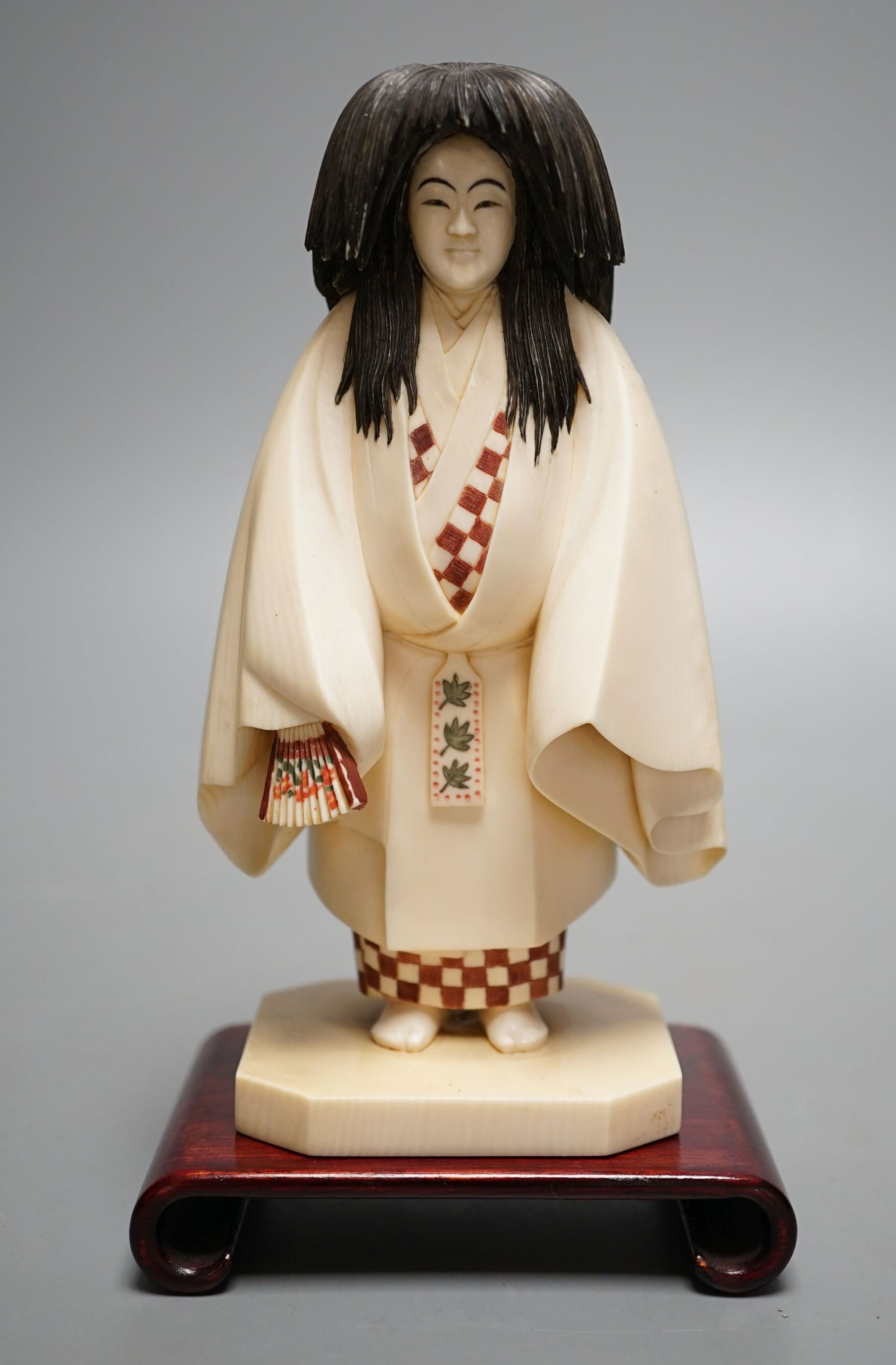 A Japanese ivory figure of a priest, Taisho/early Showa period, signed to a lacquer tablet - 17cm tall